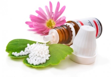 Homeopathic medication with coneflower globules. Alternative medicine concept
